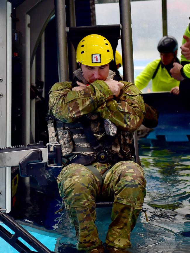 Members of the 5th Aviation Regiment undergoing HUET (Helicopter Underwater Escape Training) at Lavarack Barracks, Townsville. Picture: Alix Sweeney