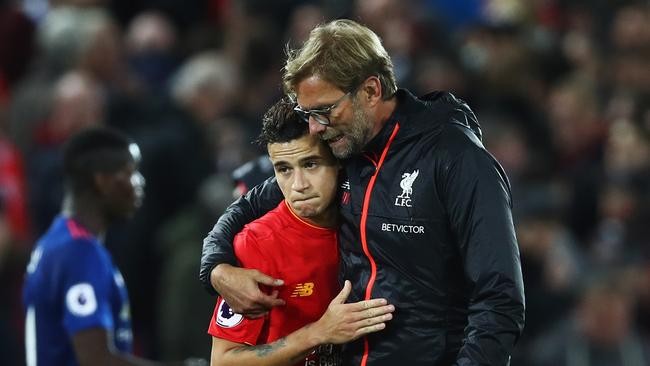 Jurgen Klopp, Manager of Liverpool talks with Philippe Coutinho of Liverpool.