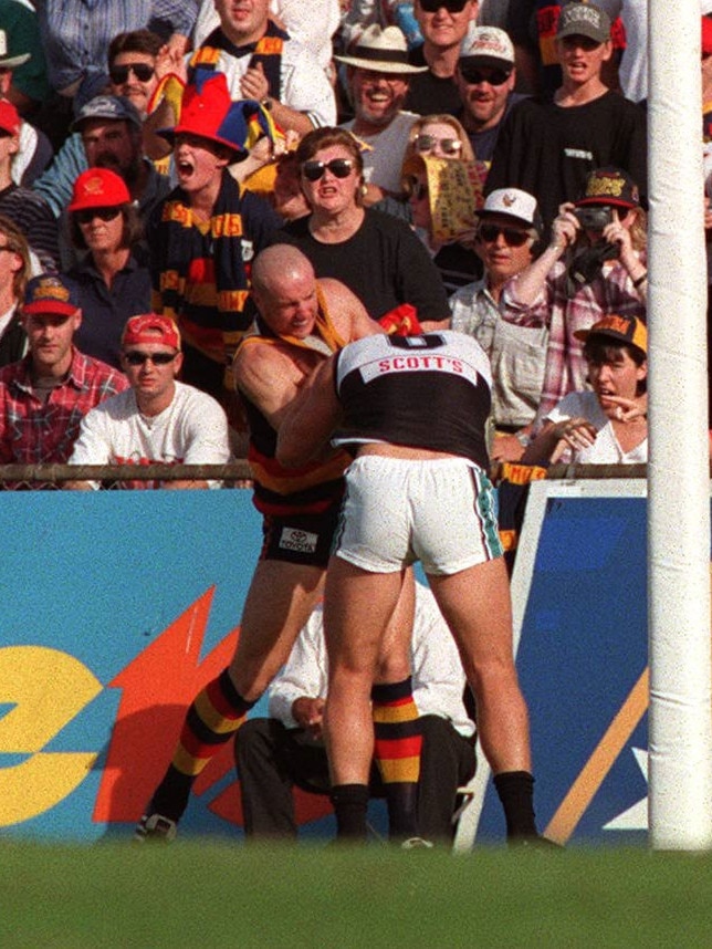 Rod Jameson and Scott Cummings start to wrestle. Picture: Titus Ray