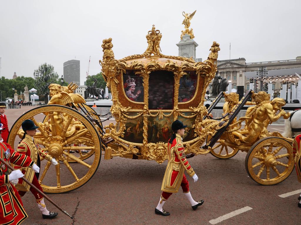 AFTER: The original golden coronation carriage with a hologram of the Queen is seen during the Platinum Pageant. Picture: Getty Images.