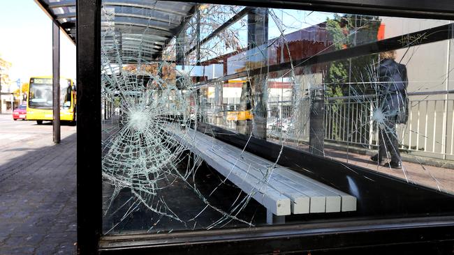 A smashed glass panel in one of the bus shelters in the Rosny Park bus mall.