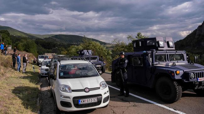 Kosovo police special unit secure the area near the Jarinje border crossing on September 20 after about 300 ethnic Serbs protest against a ban on vehicles with Serbian registration plates. Picture: Armend Nimani/AFP