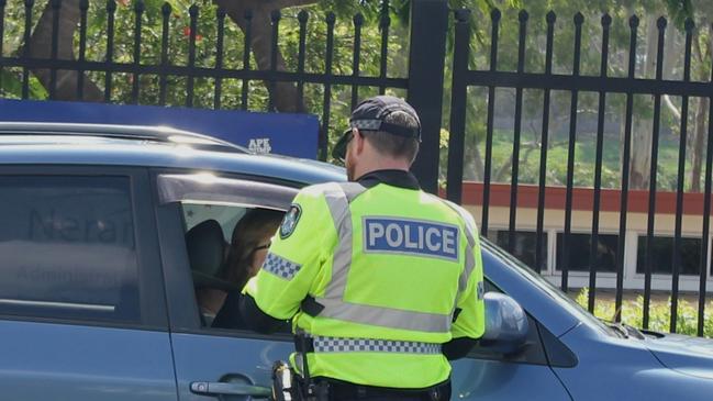 Queensland Police officers conducting breath tests next to Nerang State High School. Picture: Luke Mortimer