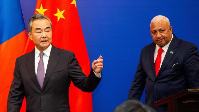 Chinese Foreign Minister Wang Yi (left) holds a joint press conference with Fijian Prime Minister Frank Bainimarama Fiji's capital, Suva, yesterday. Picture: AFP