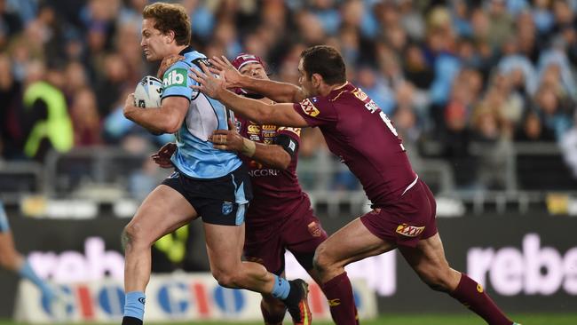 Matt Moylan, stepping through a tackle by Cameron Smith and Johnathan Thurston, was a late call-up to start the game at five-eighth in Origin III in 2016. NSW showed grit to win that game but had already lost the series. Picture: AAP