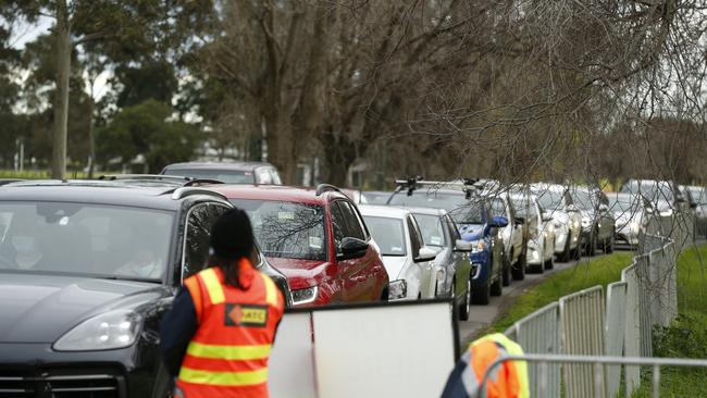 Cars are seen lining up at drive through testing site at Albert Park Lake on Sunday in Melbourne. Picture: Getty Images