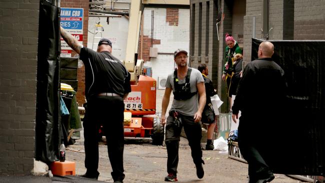 Crew prepare the Thor: Ragnarok alleyway set in Esk Lane, off Mary Street in Brisbane. Picture: Tim Marsden.