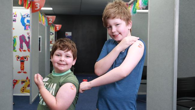 Olly Ellison, 5, and his brother Alex Ellison, 10, got their jabs. Picture: Brendan Radke