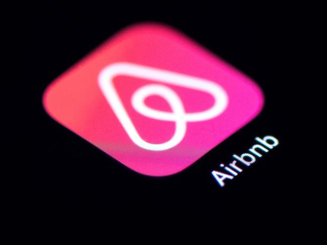 (FILES) This file photo taken on November 22, 2019 shows the logo of the online lodging service Airbnb displayed on a smartphone in Paris. - Airbnb on March 30, 2020 said it is devoting $250 million to help would-be hosts survive financial losses from refunds given to guests who cancelled travel plans due to the coronavirus pandemic. (Photo by Lionel BONAVENTURE / AFP)