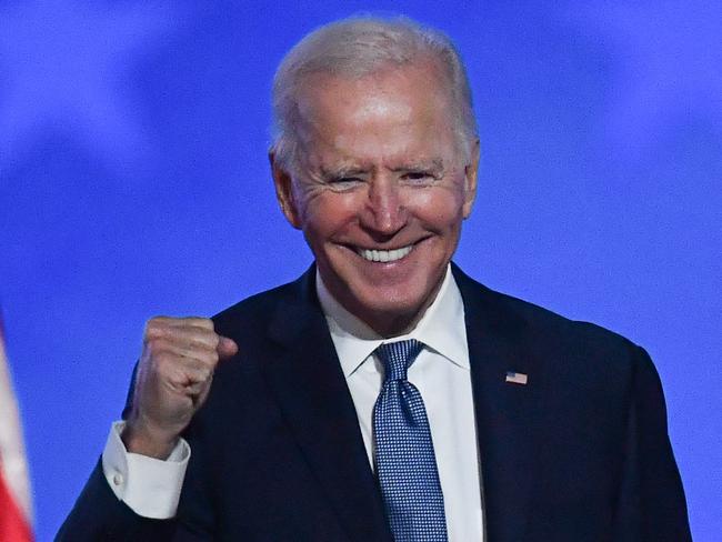 TOPSHOT - Democratic presidential nominee Joe Biden gestures after speaking during election night at the Chase Center in Wilmington, Delaware, early on November 4, 2020. - Democrat Joe Biden said early Wednesday he believes he is "on track" to defeating US President Donald Trump, and called for Americans to have patience with vote-counting as several swing states remain up in the air. "We believe we are on track to win this election," Biden told supporters in nationally broadcast remarks delivered in his home city of Wilmington, Delaware, adding: "It ain't over until every vote is counted." (Photo by ANGELA  WEISS / AFP)