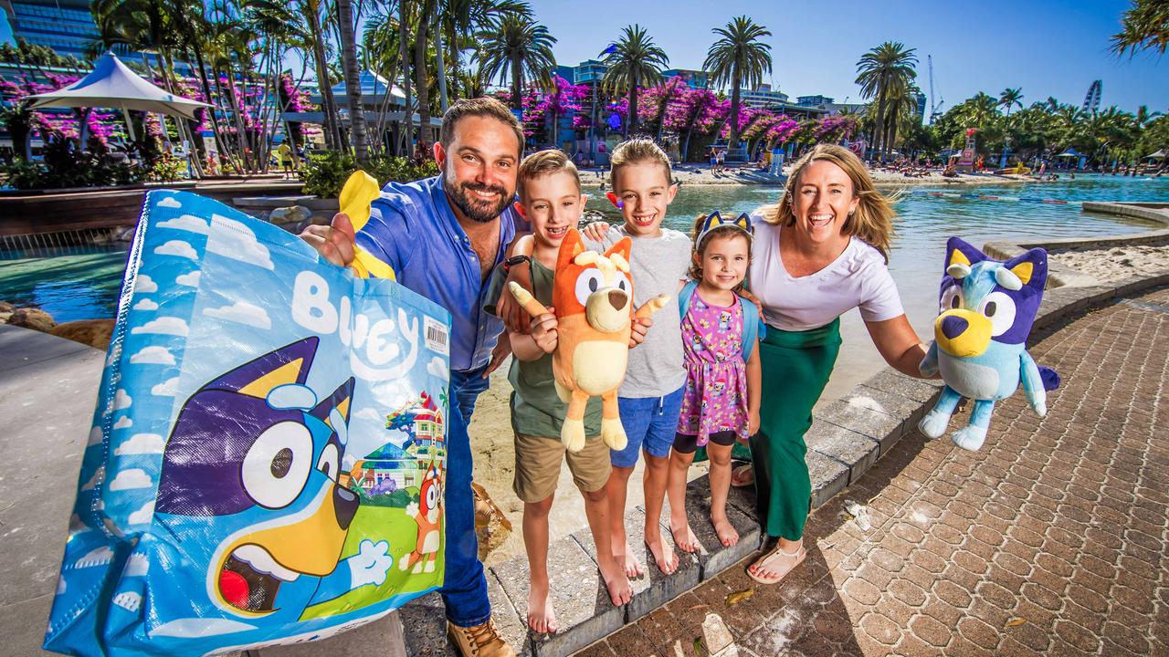 Peter and Mel Neville with their twin sons Austin and Harvey, 7, and Tahlia, 4, at Street's Beach in South Bank, Brisbane. . Picture: Nigel Hallett