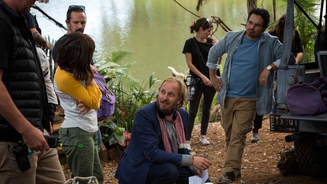 Left to right: Isabela Mone, Director James Bobin and Michael Peña on the Coomera film set.