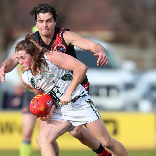 Kyabram’s Toby Wooller prepares to tackle Echuca’s Jackson Stewart.