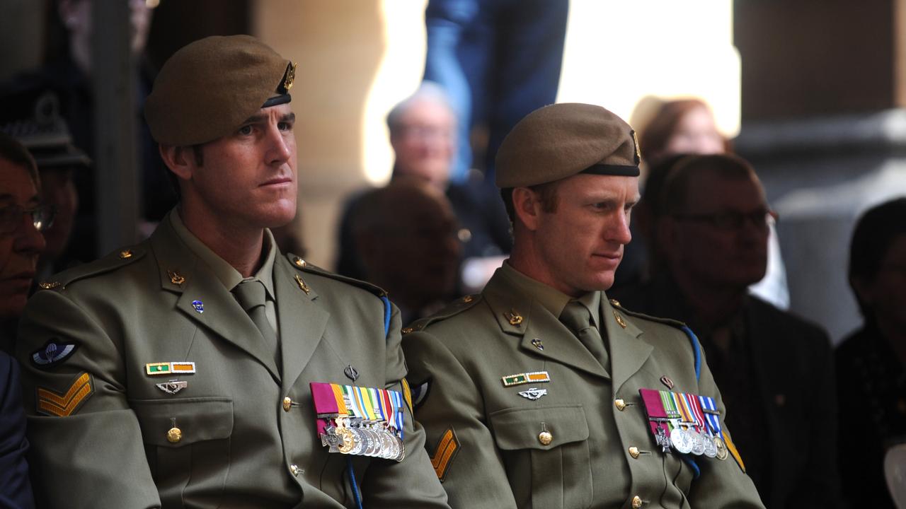 Mr Roberts-Smith and Mark Donaldson performing ceremonial duties after being awarded their Victoria Crosses, the top military honour. Picture: AAP