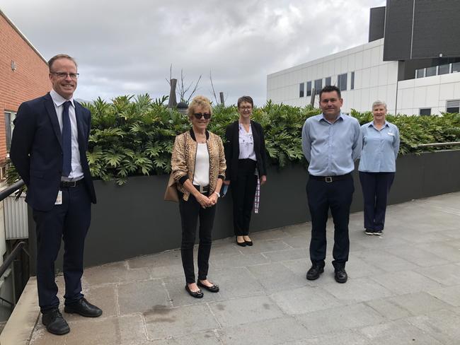Illawarra Cancer Centre's Dr Brungs, Deanna Hughes, (name), Grant Hughes and nurse (Name).