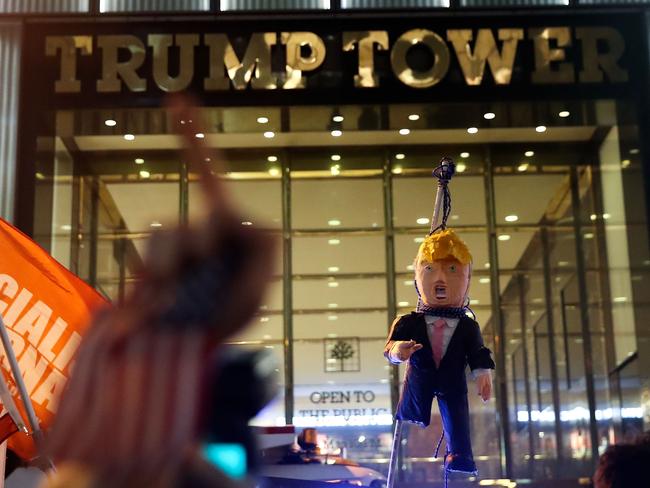 Protesters hoist an effigy of Donald Trump with a noose around his neck outside of Trump Tower in New York City. Picture: Drew Angerer/Getty Images/AFP