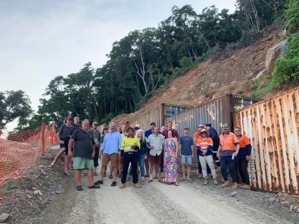 Cape Tribulation locals and road works employees have celebrated the âfirst birthdayâ of a landslide which left the remote town isolated, following torrential rain and flooding after Cyclone Jasper in 2023. Photo: Supplied.