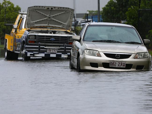 Couple of vehicles caught out by water at Pinkenba. Picture: David Clark