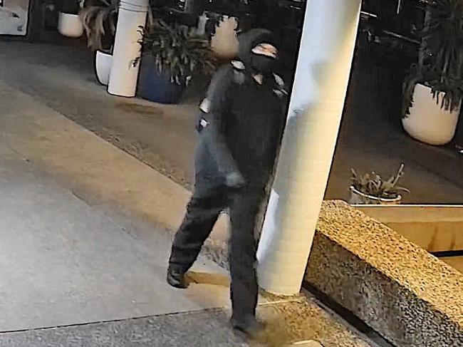 Strike Force Coybil detectives have released images of a suspect wanted over the stabbing of teenager Brodie Young at Newcastle Baths on June 14, 2021. Image is of the suspect walking past The Brewery at Queens Wharf about 9.06pm, about 30 minutes before the attack. Picture: NSW Police.