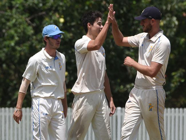 Ben Davis (centre) celebrates a wicket with his Gold Coast teammates against Wests on Saturday. Picture: Steve Holland