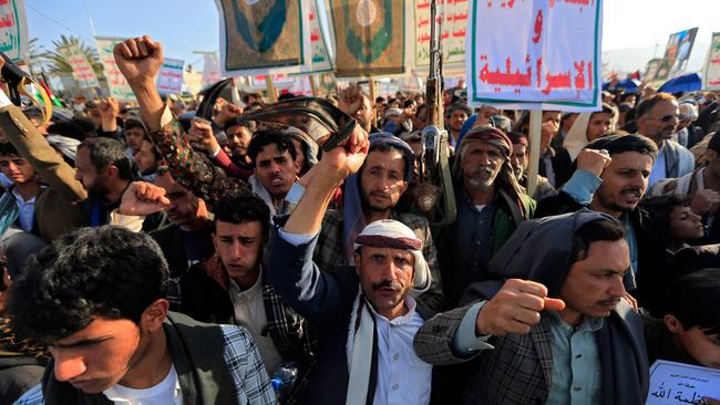 Yemenis wave flags and hold placards during a demonstration denouncing Israeli strikes and in solidarity with Palestine. Picture: AFP