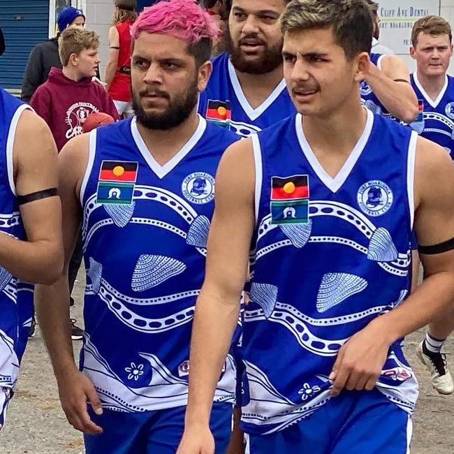 Port Noarlunga Aboriginal players, including Ian Milera and Connor Sampson (front L-R) wearing a special indigenous-designed guernsey. Picture: Achieve Video Marketing via Port Noarlunga’s Facebook page