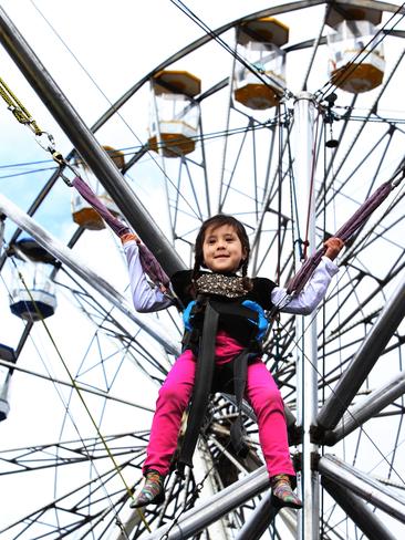 Mia Sice, 5, of Norwood, tries out the Bungies.