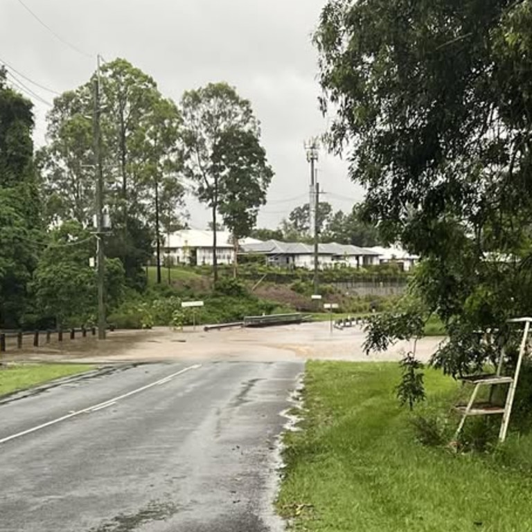 Camp Mountain Road flooded near the childcare centre. Pic: Leah Hudson