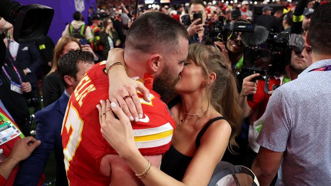 Swift and new beau Travis Kelce were in a love buzz when the pop star revealed her new “heartbreak” record. Picture: Getty.