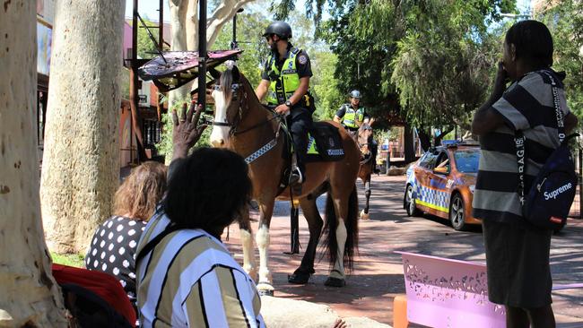 Police on horses patrol the Todd Mall. Picture: Jason Walls