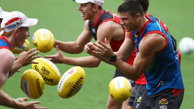 Sam Collins (right) during Gold Coast training at Metricon Staidum. Picture: Jason O'Brien