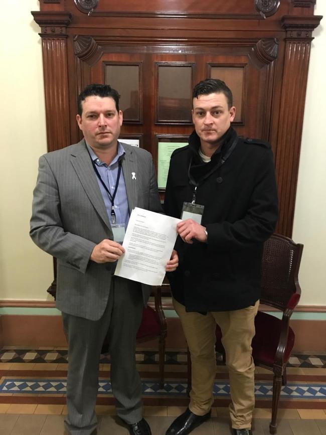 Karen Belej’s brothers Chris and Tim Belej attend parliament to see a petition for tougher sentencing tabled.