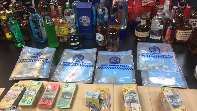 Alcohol, drugs, and cash that police will allege were the proceeds of a drug-supply racket in Doonside led by Richard Schaaf. Picture: Supplied