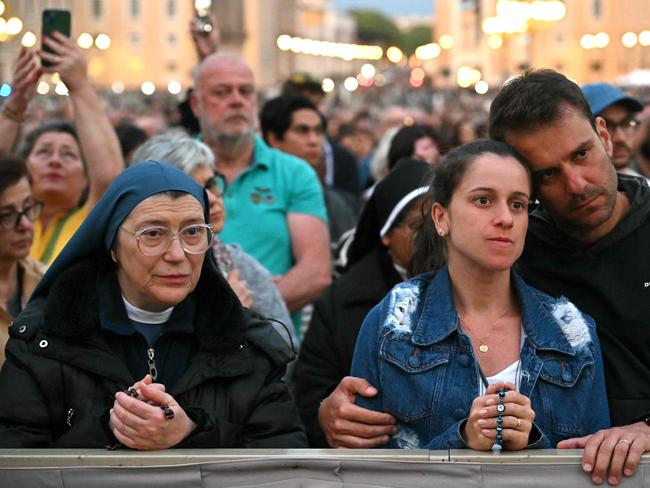 Devotees attend a Rosary in homage to Pope Francis at the Vatican. Picture: AFP