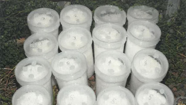 Buckets of ketamine seized by AFP, found in cement shipped from overseas.