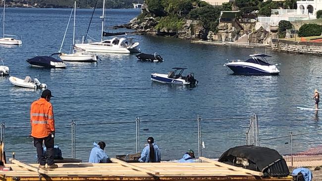 Contractors working at the reserve behind Little Manly Beach on Friday. Picture: Jim O'Rourke