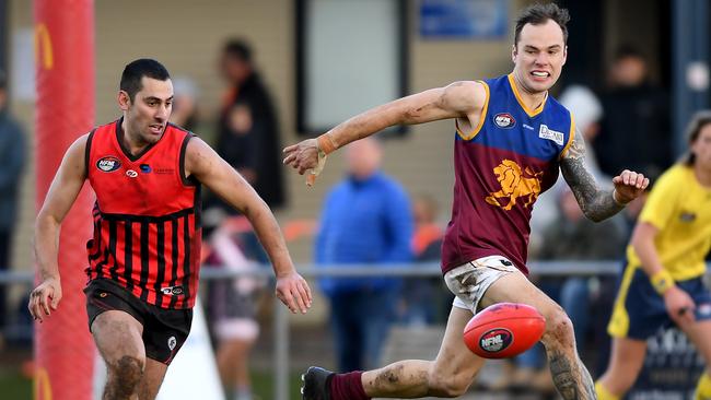 Alek Tsardakis and Aiden Grace keep their eyes on the ball. Picture: Andy Brownbill