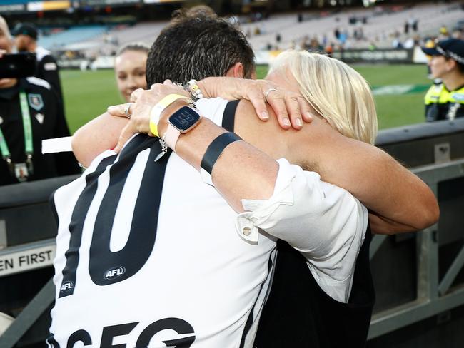 MELBOURNE, AUSTRALIA - MARCH 24: Travis Boak of the Power is embraced by his mother Chicki during the 2024 AFL Round 02 match between the Richmond Tigers and the Port Adelaide Power at the Melbourne Cricket Ground on March 24, 2024 in Melbourne, Australia. (Photo by Michael Willson/AFL Photos via Getty Images)