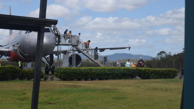 Passengers disembark from a plane at Whitsunday Coast Airport. Picture: Laura Thomas