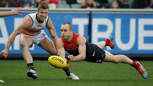 Cross fires out a handpass against GWS. Picture: George Salpigtidis