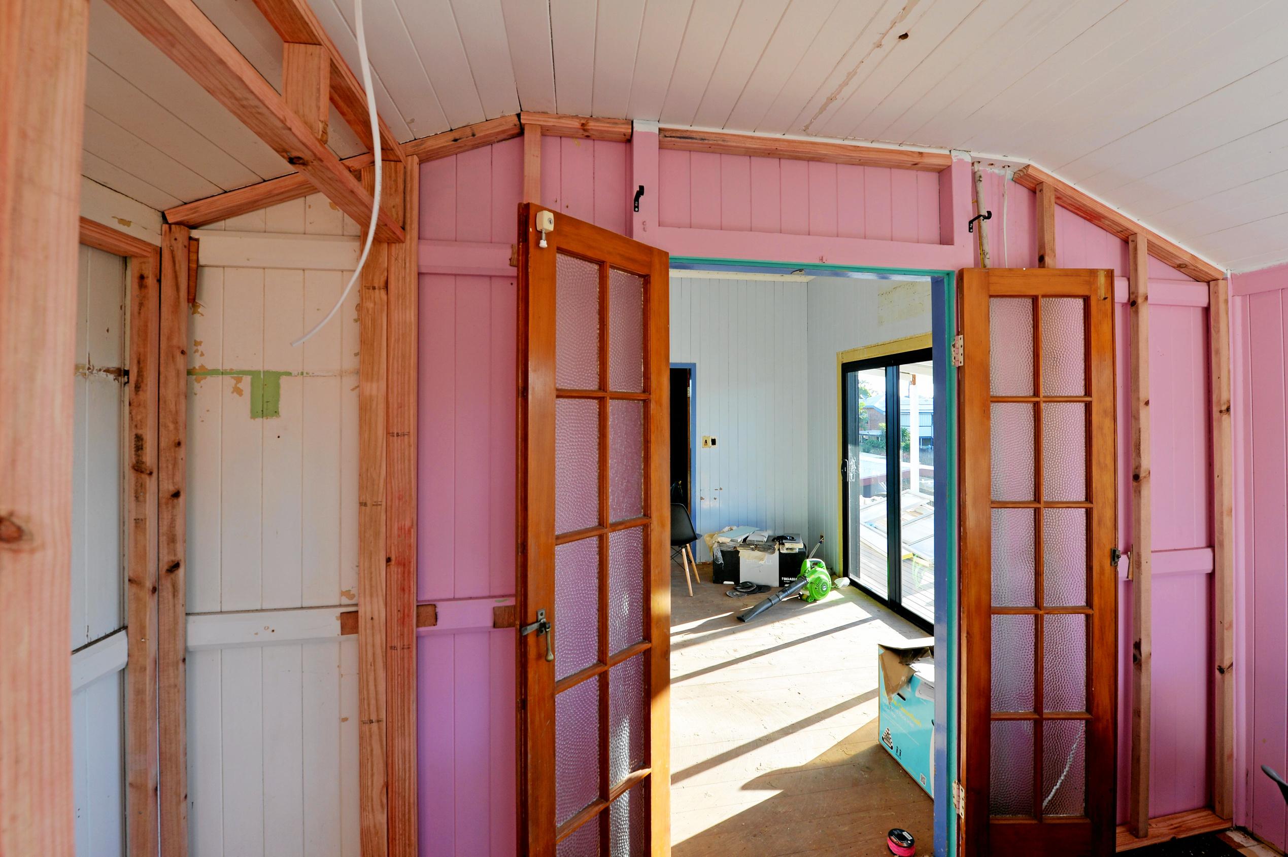 Mackay house-flippers Madison Strutynski and Michael Cotter at their Hunter St, West Mackay property. Picture: Stuart Quinn