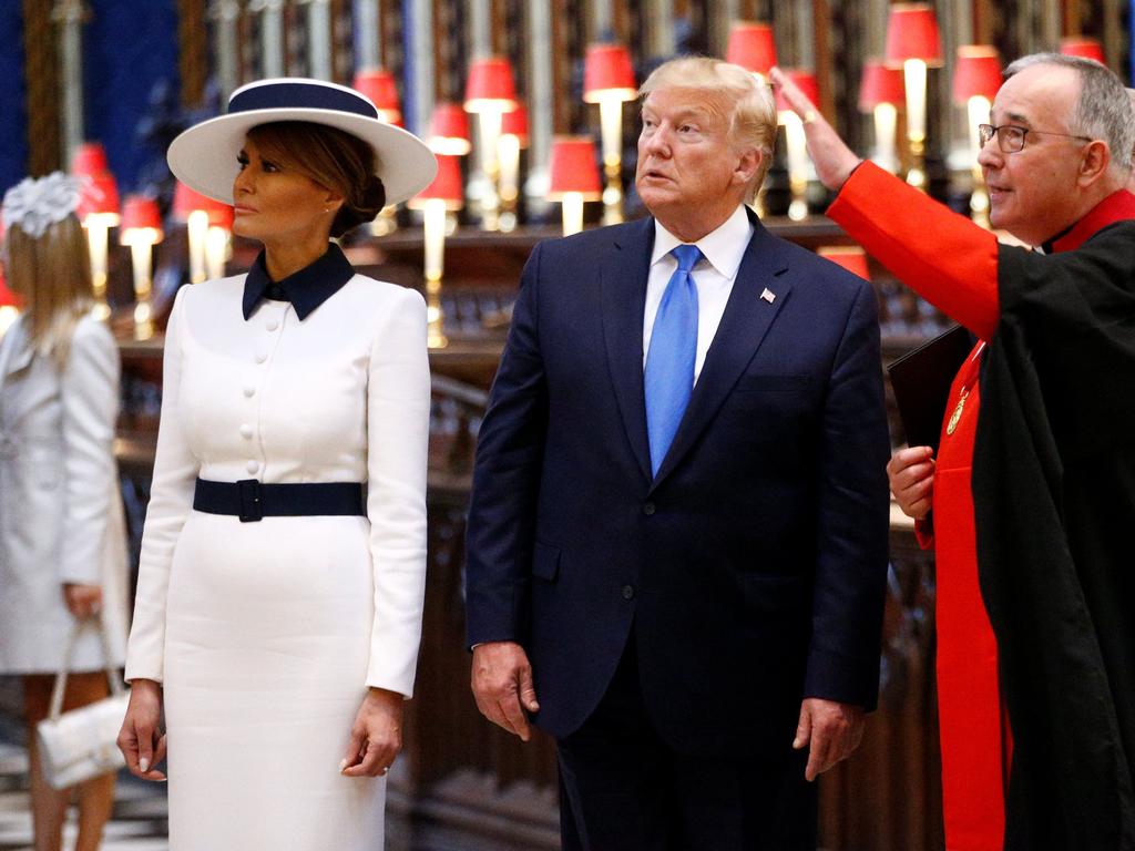 US President Donald Trump (C) and US First Lady Melania Trump (L) are shown around Westminster Abbey by the Dean of Westminster, John Hall. Picture: AFP