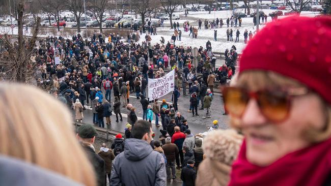 People gather to block the highway in Belgrade as they protest against Rio Tinto's plan to open a lithium mine in the country.