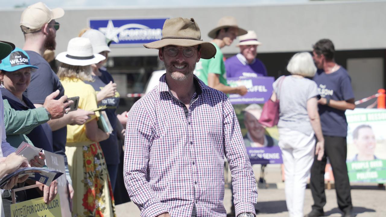 Say No To Woke council candidate Nathan Essex stands at the Toowoomba pre-polling centre in Newtown.