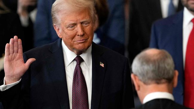 TOPSHOT - Donald Trump is sworn in as the 47th US President in the US Capitol Rotunda in Washington, DC, on January 20, 2025. (Photo by Julia Demaree Nikhinson / AFP)