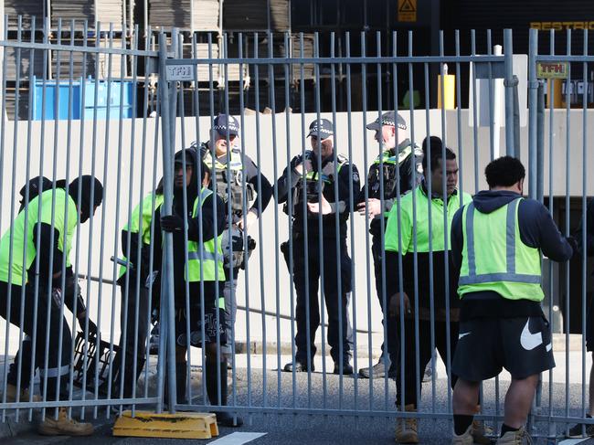 Police patrol the exhibition building. Picture: David Crosling