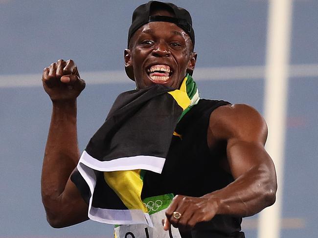 Usain Bolt celebrates in lane 4 after winning the Gold medal for Jamaica in the MenÕs 4 x 100m Relay Final during day 14 of the Rio 2016 Olympic Games. Picture: Brett Costello