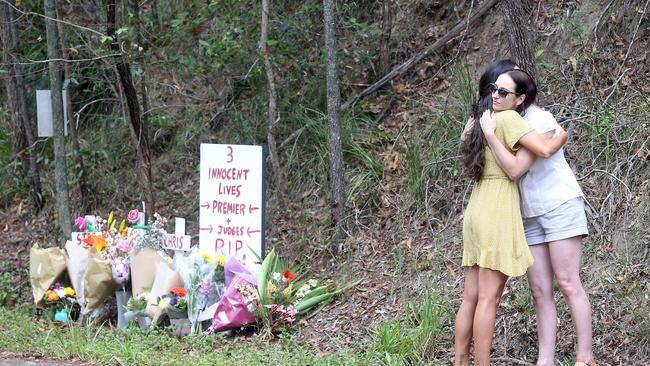 Claudine Snow hugs a community member in Bonogin. Picture: Richard Gosling