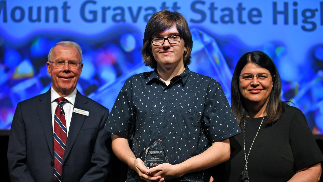 Student Jayden Webster with chairman of QCAA Brian Short and MP Grace Grace. The Mount Gravatt State High School student Jayden Webster was awarded the Highest Achievement by an Aboriginal or Torres Strait Islander Student. Picture: AAP/John Gass