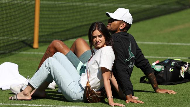 The loved-up couple relax during a break at last year’s Wimbledon. Picture: Julian Finney